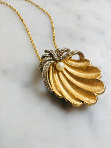 Graceful lovely shell embodies the spirit of Aphrodite or a mermaid. Vintage 1950s reset on 22ct gold vermeil chain.